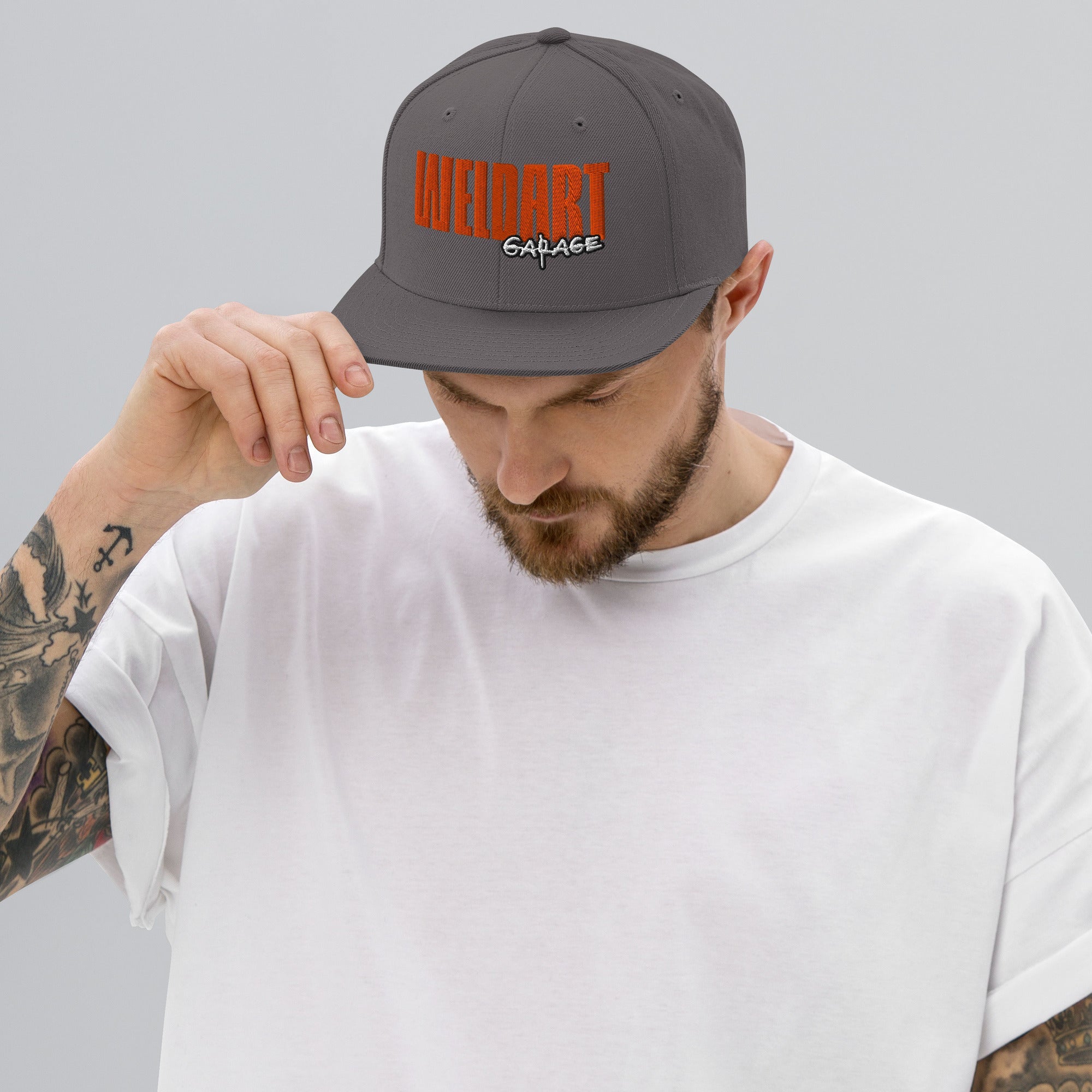 Snapback-Cap "Weldart Garage" bestickt